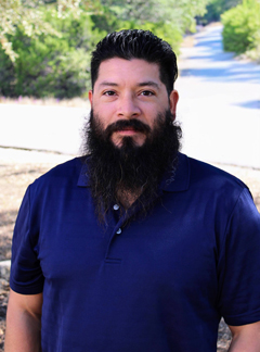 WCID No. 17 Operations Manager smiling, wearing professional business attire.
